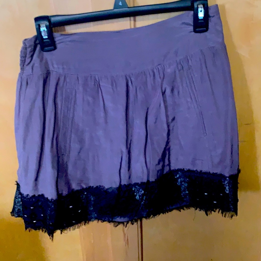 Purple skit with black and sequins hemm.